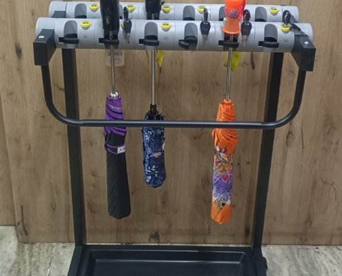 UMBRELLA STAND WITH LOCKABLE SLOTS